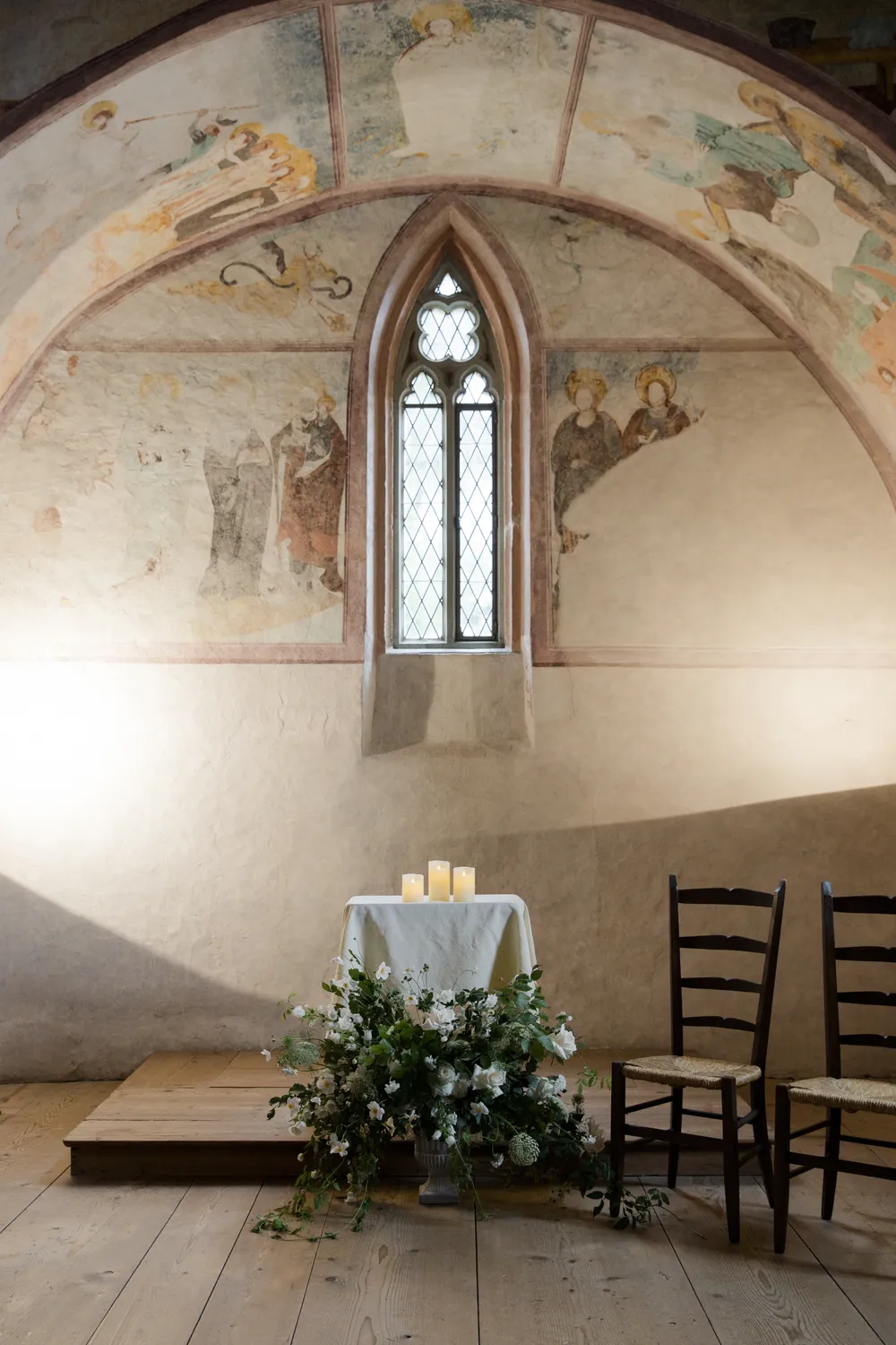 Iconic water tower of Schloss Oberhofen on Lake Thun, featuring a sophisticated and historical wedding aesthetic by ROOXI STUDIO.