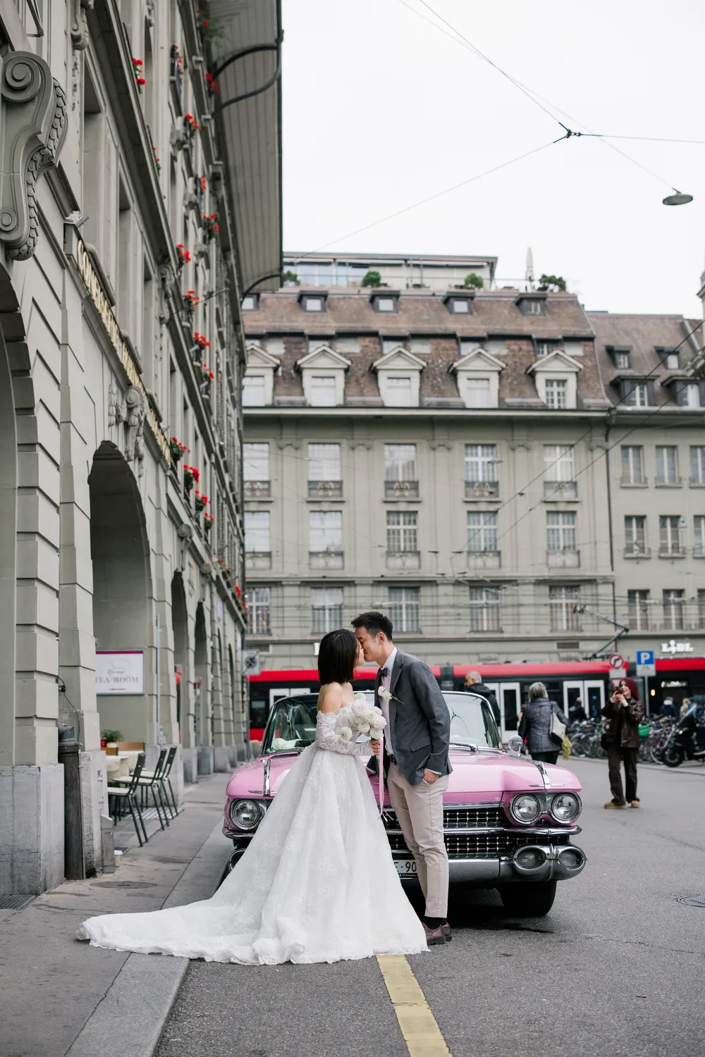 Intimate bride and groom portrait in a vintage wedding car in Bern