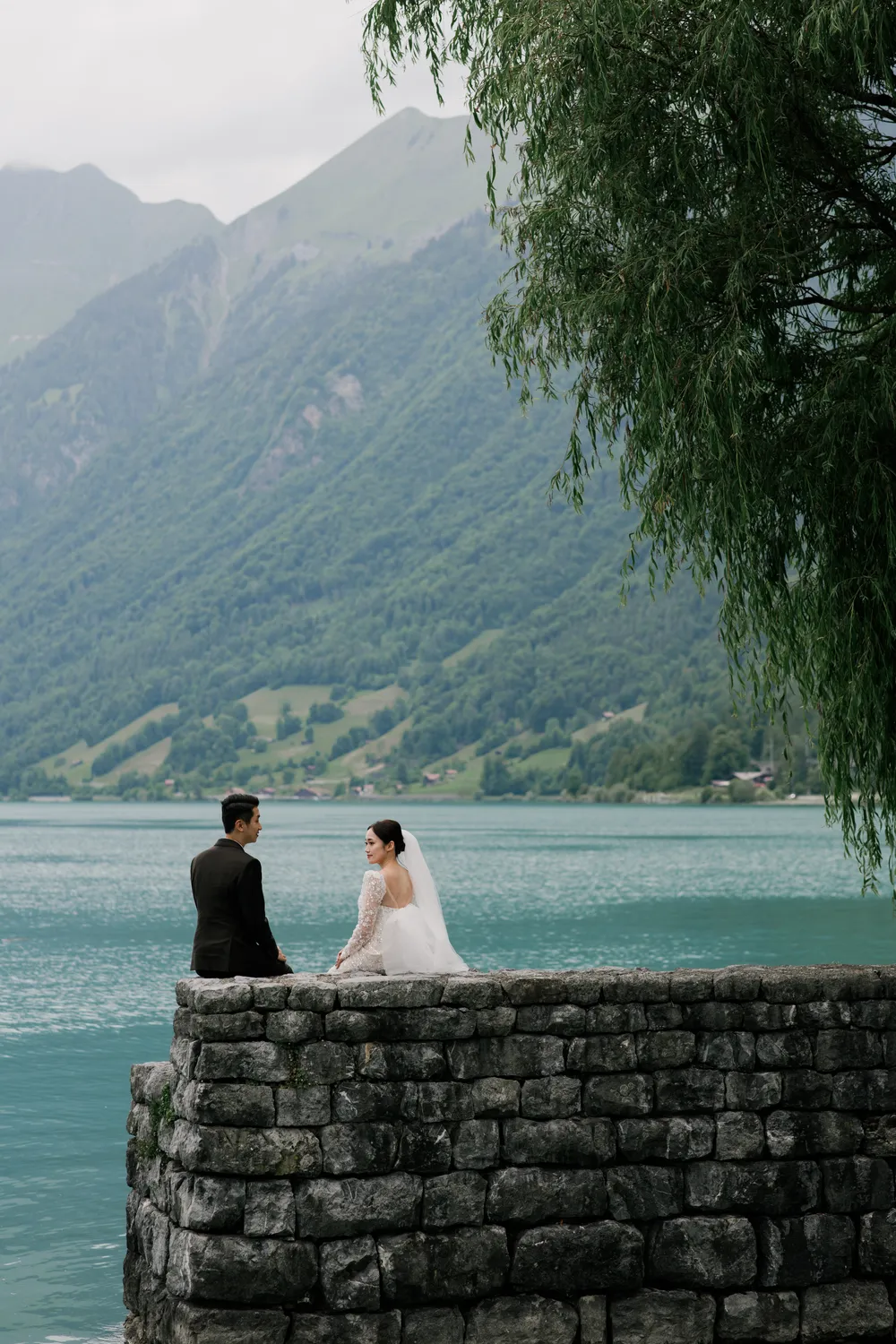 Romantic **lakeside photoshoot** at Lake Brienz during a June Swiss pre-wedding journey.