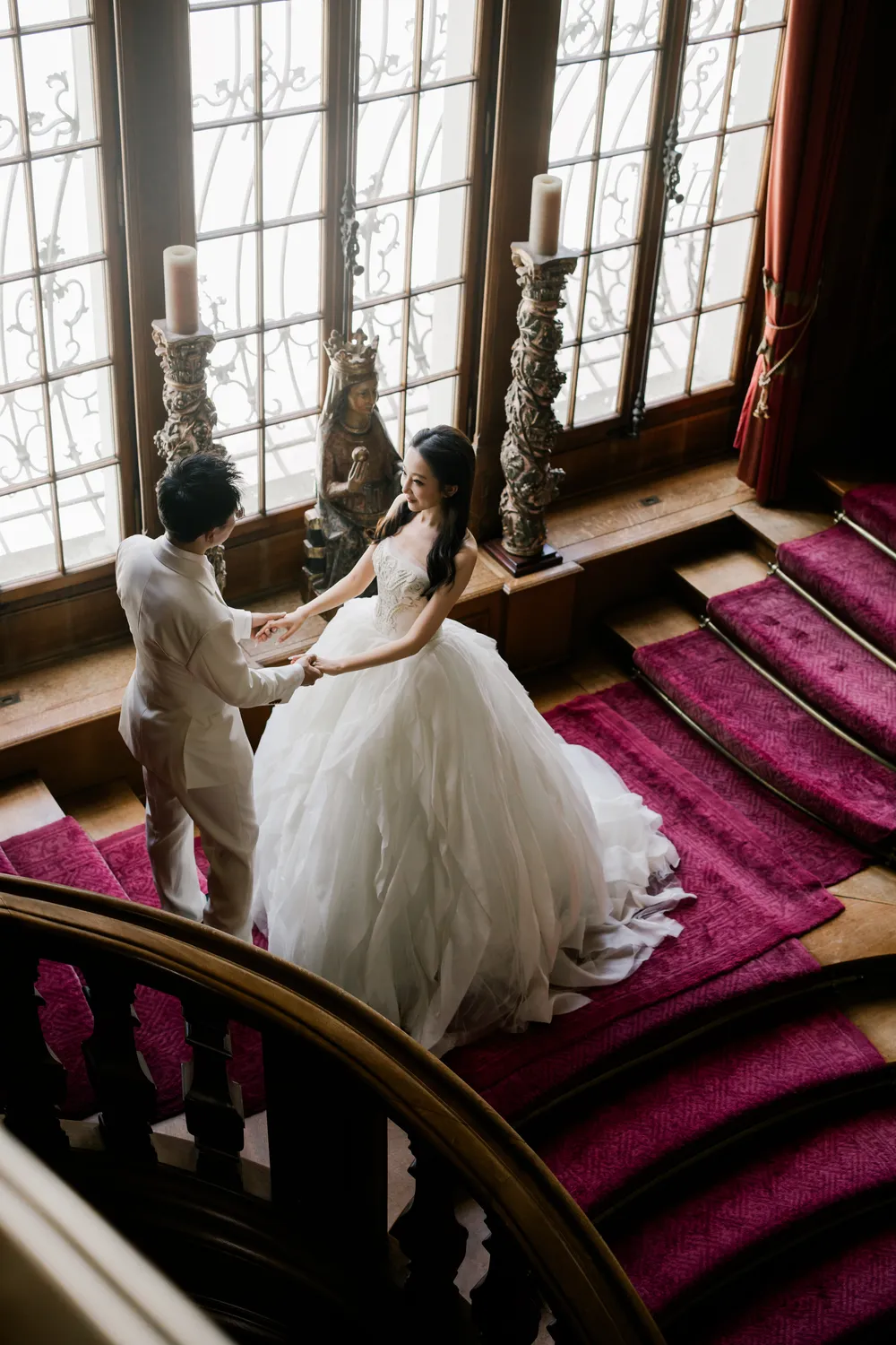 Elegant bride and groom portrait inside the ornate halls of St. Charles Hall