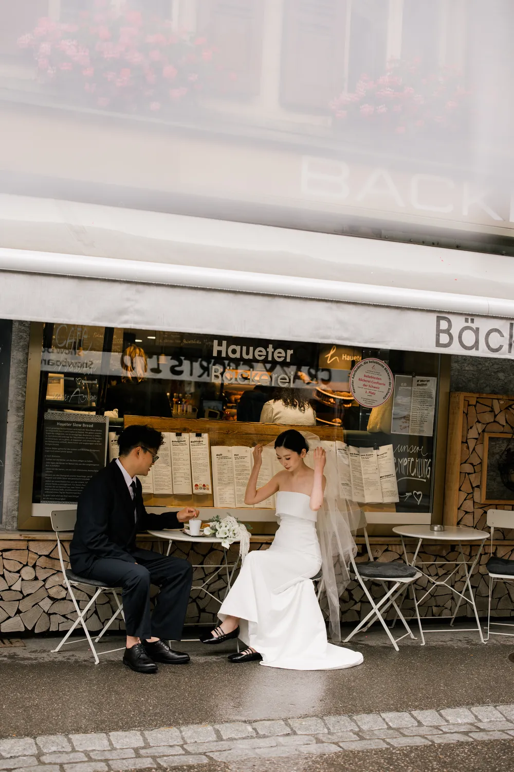 Romantic wedding moments in a charming Swiss village cafe in Adelboden