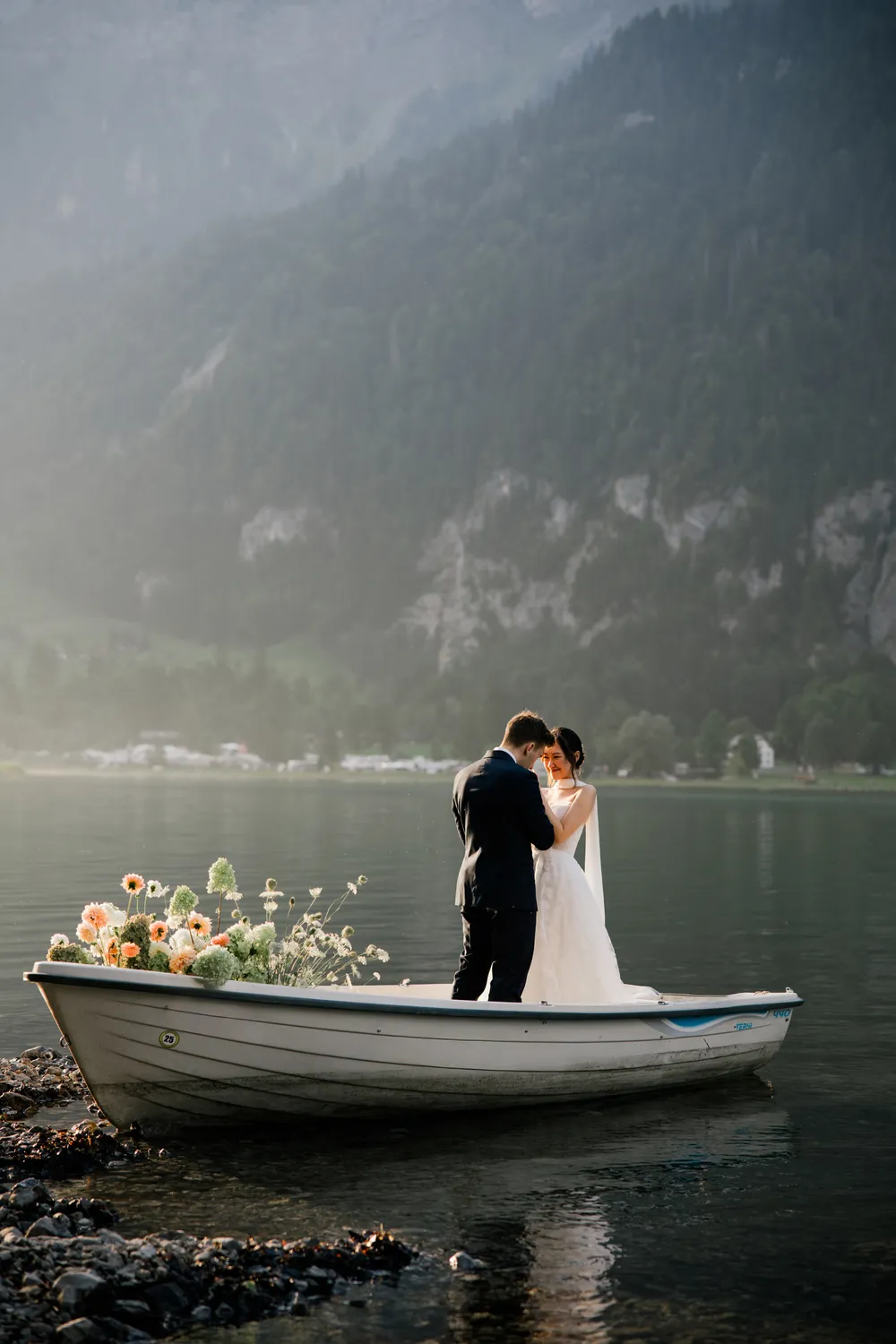 Warm golden hour glow on a couple during their private boat ceremony in Switzerland