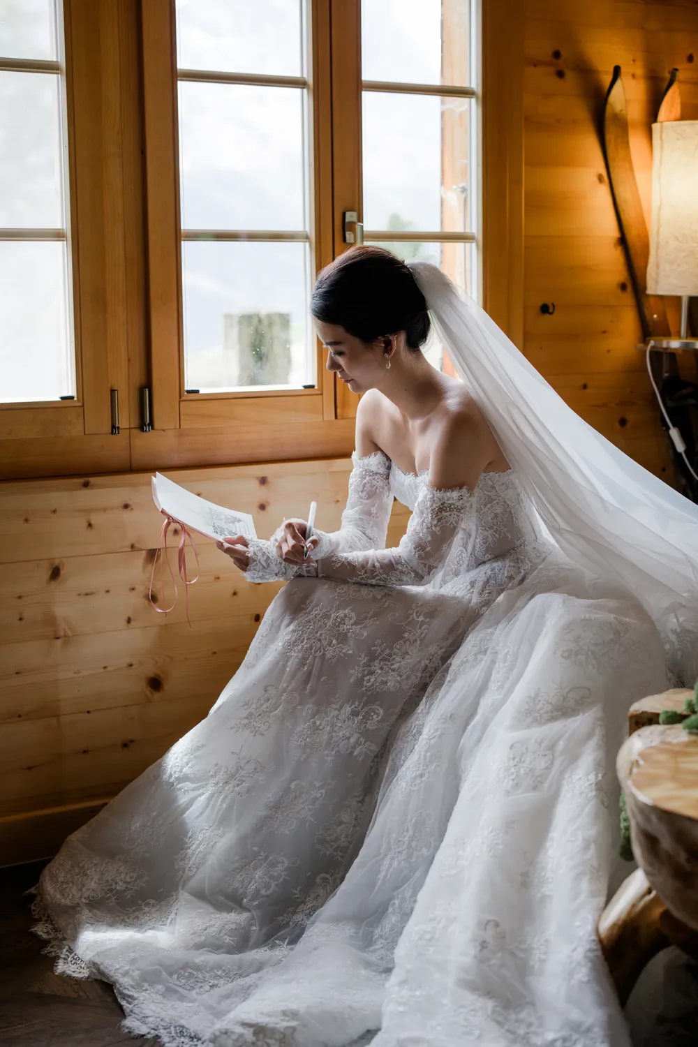 andid **bridal photography** inside a cozy wooden chalet in **Grindelwald**, focusing on the private getting-ready moments.